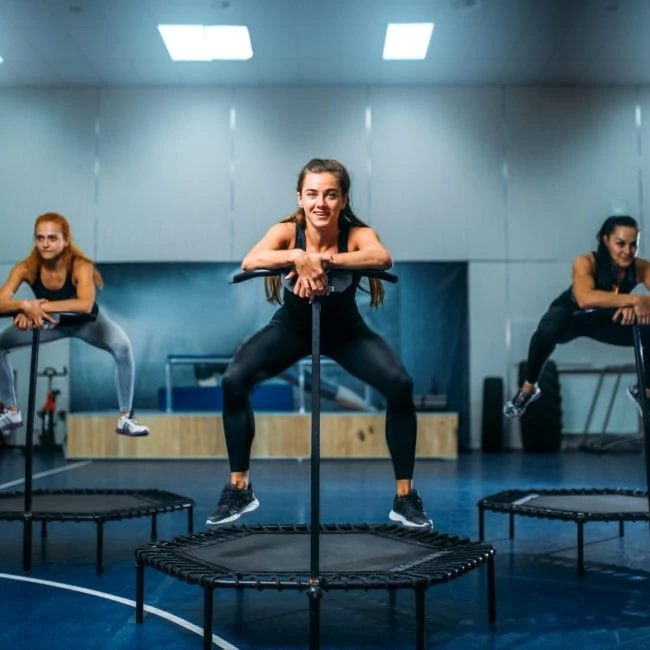 women on trampoline in motion fitness training PPZVB4G